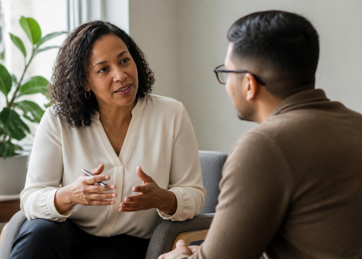 A manager and an employee in a one-on-one coaching conversation